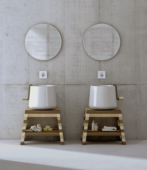 Two white deep basins in the shape of buckets standing on a wooden platform with wooden soap dishes hanging on the edges