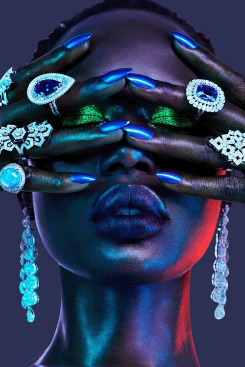 Black woman's face painted blue