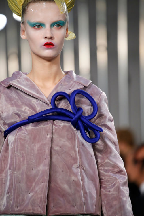 Maison Margiela, a model with red lips wearing a blue rope belt