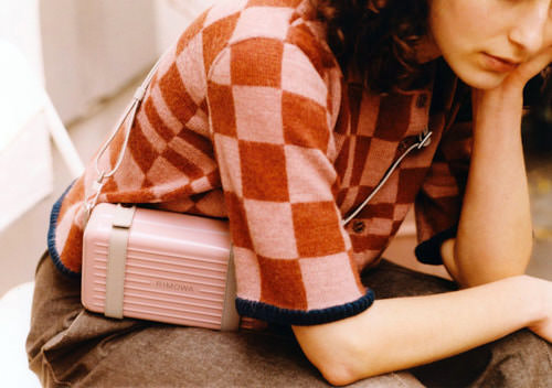 Girl in a pink and brick chequered jumper
