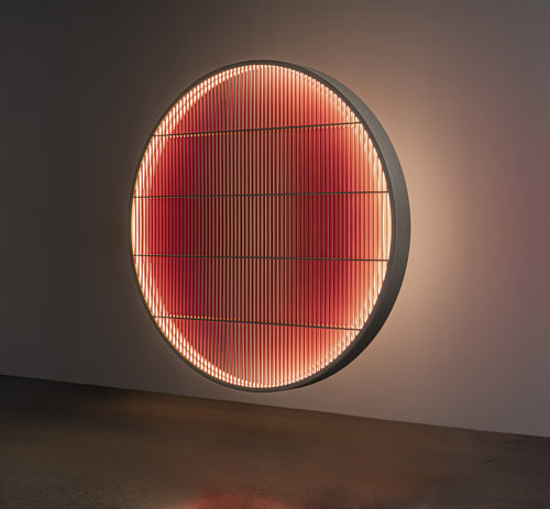 Wooden illuminated wall decoration resembling a round window with wooden rungs